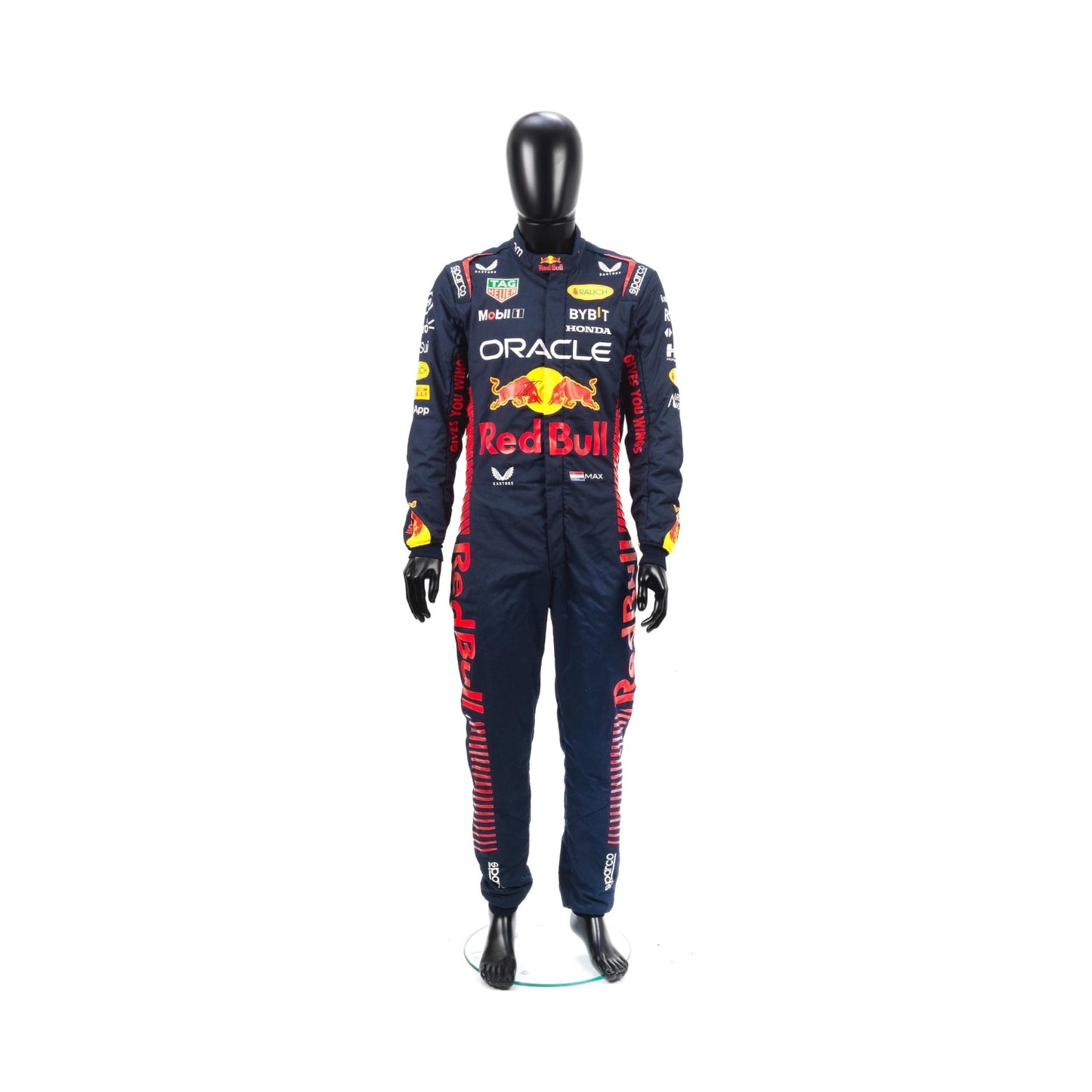 Max Verstappen's 2023 F1 racing suit in deep navy blue with bold red side panels, yellow trim, and partner branding across the chest and legs.