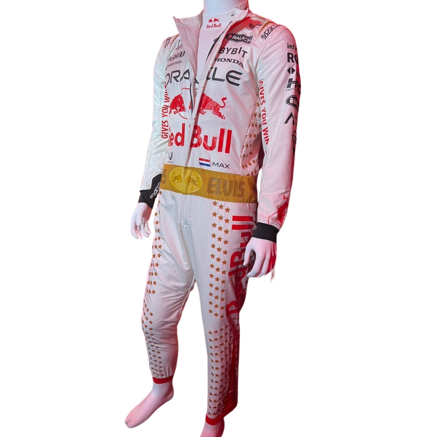 Max Verstappen in the 2023 Las Vegas GP racing suit featuring a crisp white base with gold star embellishments, red accents, and a signature Elvis-style belt.