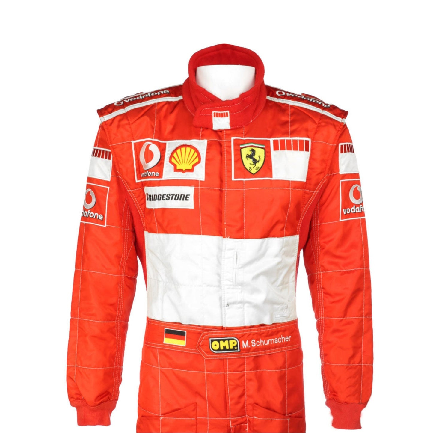 Close-up shot of Schumacher’s 2006 race suit, highlighting the detailed stitching, premium red material, and signature white branding elements.