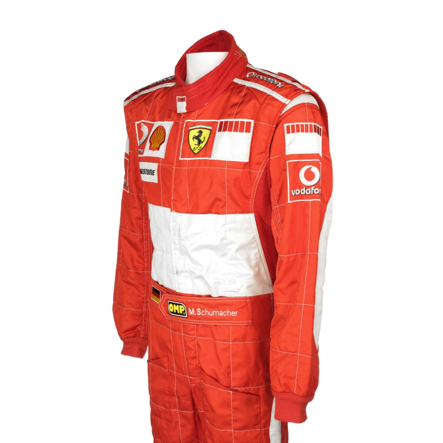Side profile of the 2006 F1 suit worn by Michael Schumacher, featuring bright red fabric with sleek contouring and high-visibility white accents.