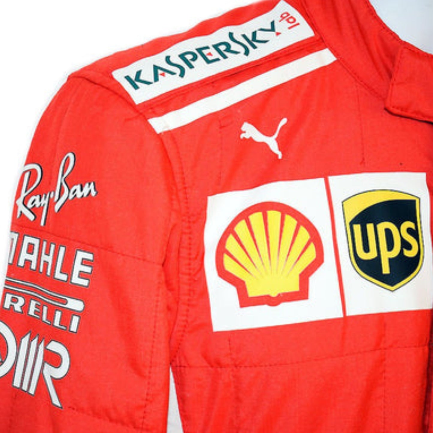 Side profile of Sebastian Vettel’s 2018 F1 racing suit, highlighting the bold red fabric with streamlined white sponsor graphics.