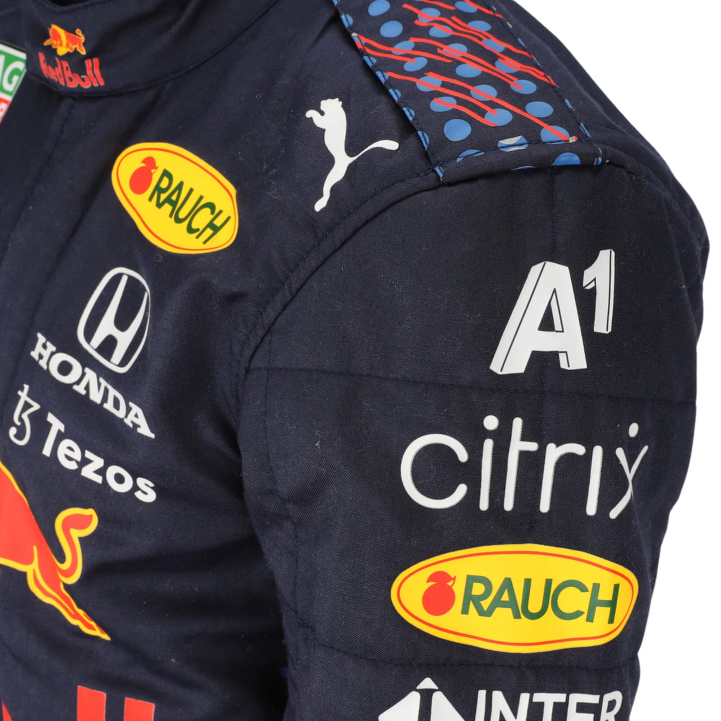 A detailed shot of the Sergio Perez 2021 F1 Racing Suit capturing the fine fabric details, precise stitching, and sponsor logos. This close-up view highlights the advanced materials used for comfort and performance during intense races.