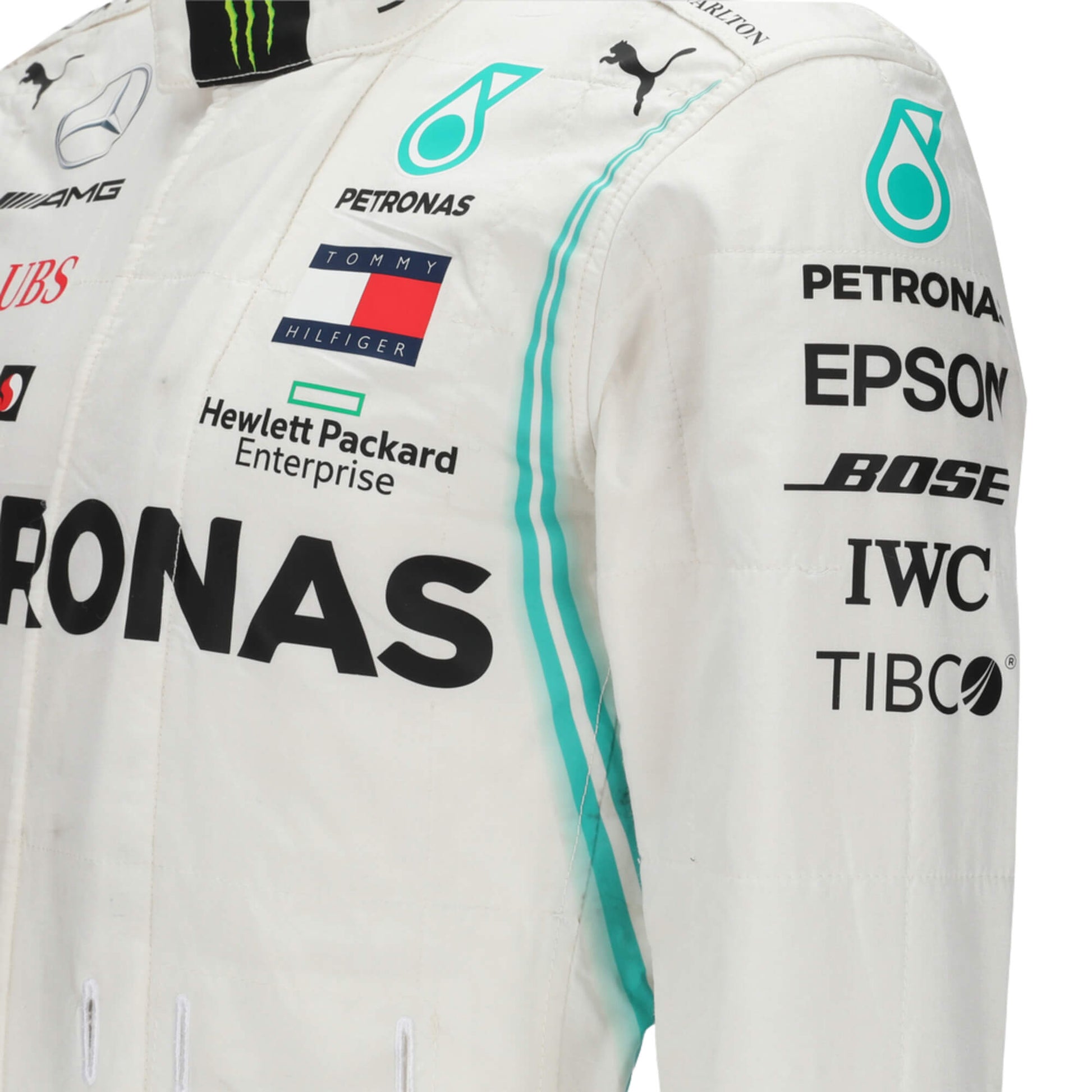 Close-up of the sleeve of Valtteri Bottas’s 2018 F1 racing suit, focusing on embroidered sponsor logos and reinforced stitching for maximum durability during intense racing conditions.