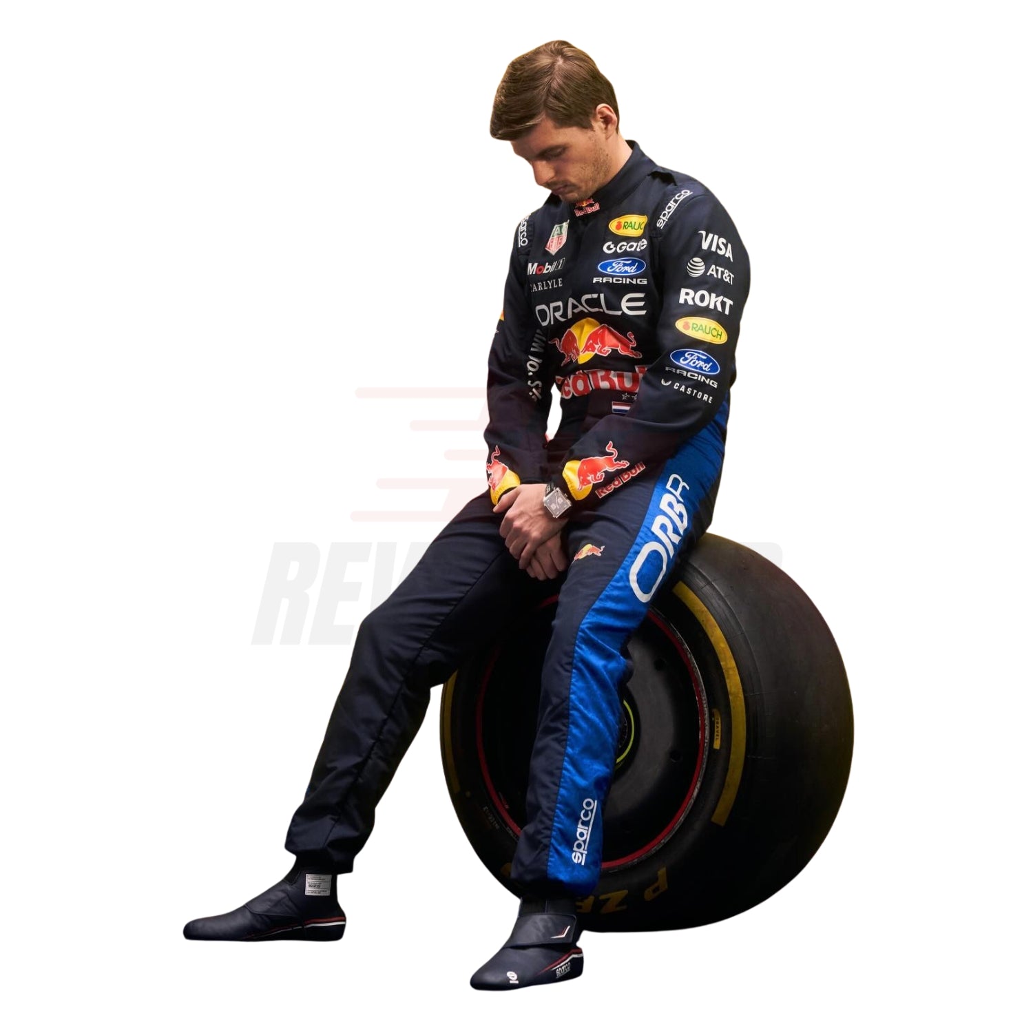 Side profile of 2026 Max Verstappen racing suit displaying sleeve sponsors and team colors, sitting on a large car tire with visible branding - Revex Gear