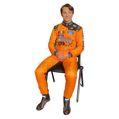 Oscar Piastri 2026 papaya orange F1 racing suit front view with number 81 and sponsor logos sitting on a chair - Revex Gear
