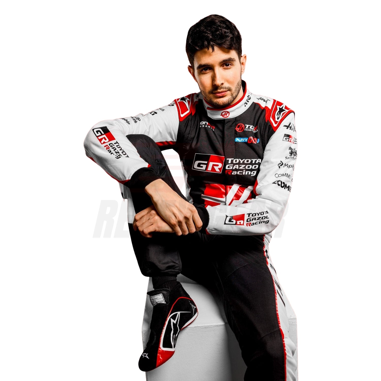 Esteban Ocon suit 2026 close up wearing a Toyota Gazoo on a white background