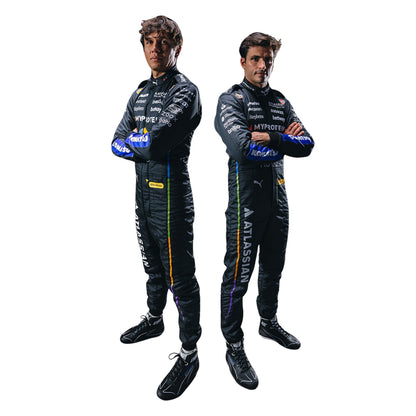 Two individuals wearing black racing suits with various logos on a white background