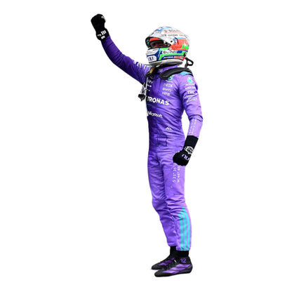 Kimi in a purple racing suit with a helmet, celebrating with one arm raised on a white background.