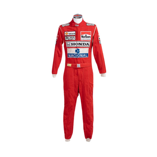 Front view of Ayrton Senna’s 1988 Stand21 F1 racing suit in bright red with white panels and detailed sponsor patches, worn during his championship-winning season.