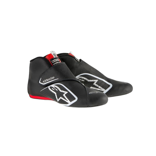 Black Carlos Sainz 2017 F1 racing shoes with visible branding on a white background