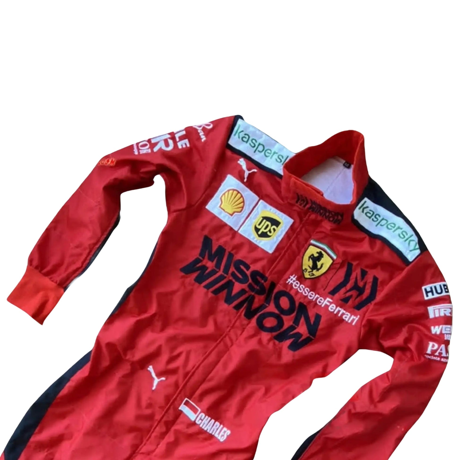 Close-up of the front upper section of Leclerc's 2020 race suit, highlighting detailed Ferrari and 1000 GP logo embroidery on 2-layer fabric.

