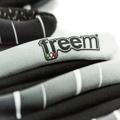 Close-up of gray and black Freem Jecko Racing gloves with 'freem' logo.