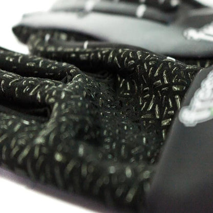Close-up of a black textured Freem Jecko Racing Gloves with a blurred background