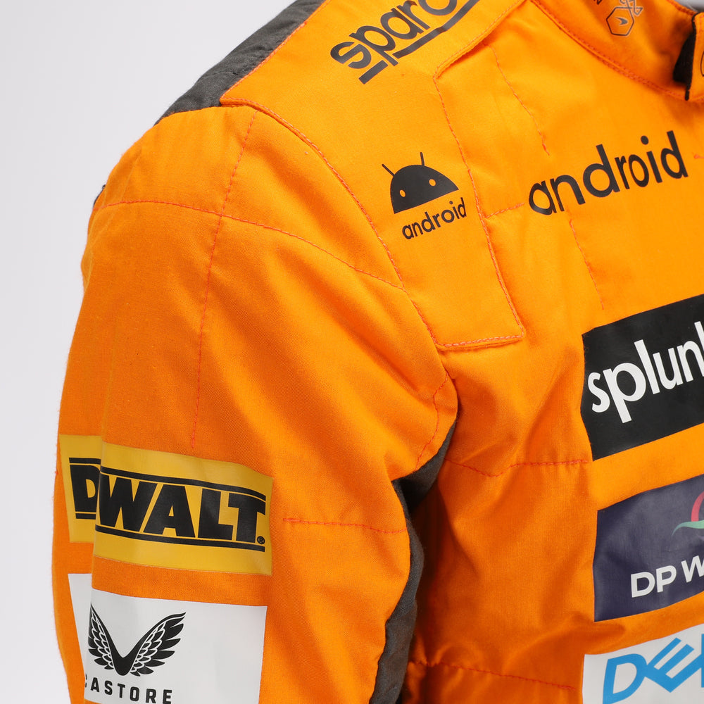 Close-up of the special edition Spanish GP racing suit showcasing premium fabric texture and subtle commemorative graphics.