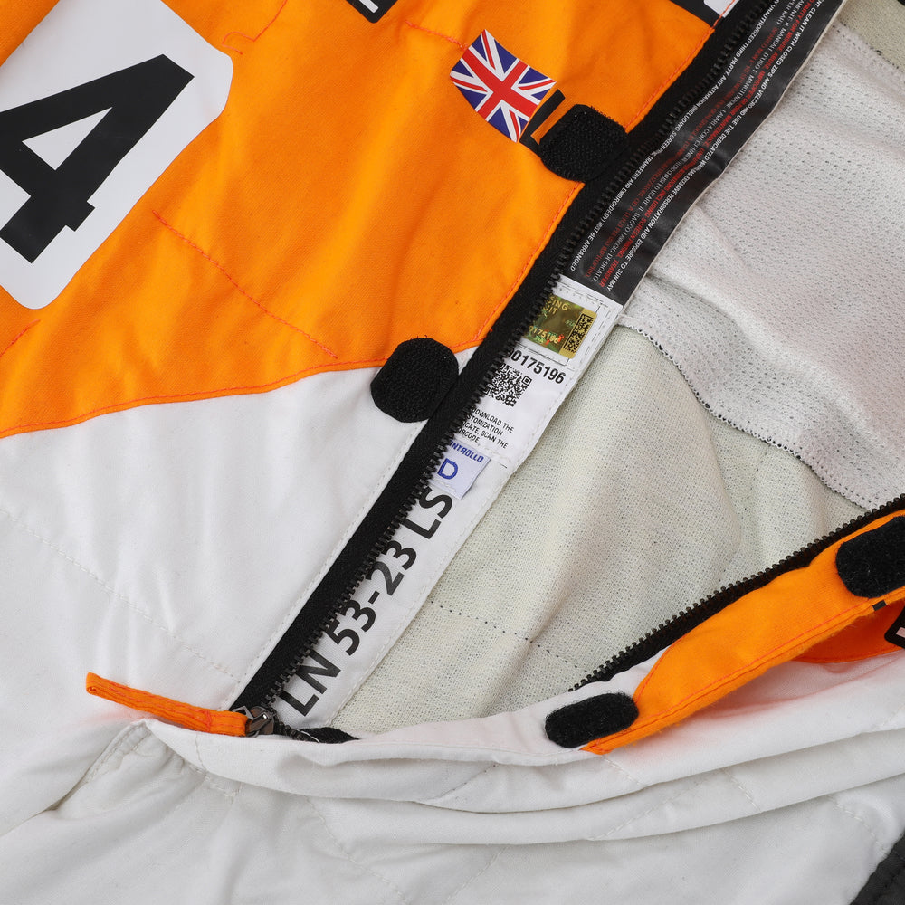 Close-up of the special edition Spanish GP racing suit showcasing premium fabric texture and subtle commemorative graphics.