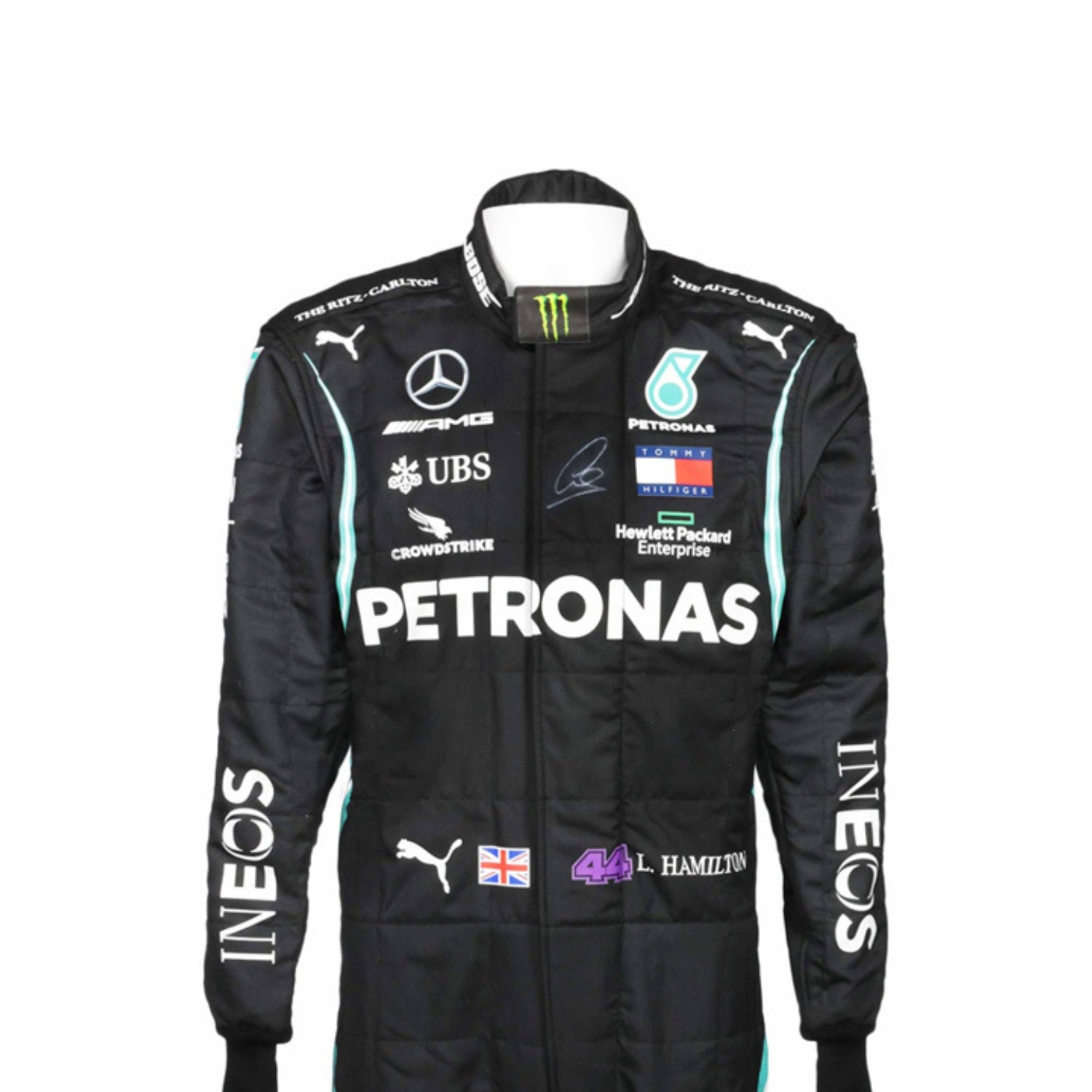 Close-up of Lewis Hamilton’s 2020 F1 suit revealing black fabric with turquoise stitching and sponsor details, worn during his legendary seventh title run.