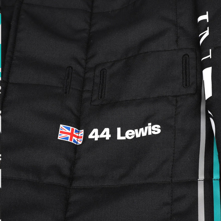 Close-up of Hamilton’s 2023 F1 suit detailing the fabric texture and fine stitching, with clear sponsor placements.