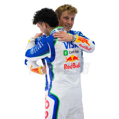 Liam Lawson and Arvid Lindblad in racing suits hugging each other on a white background