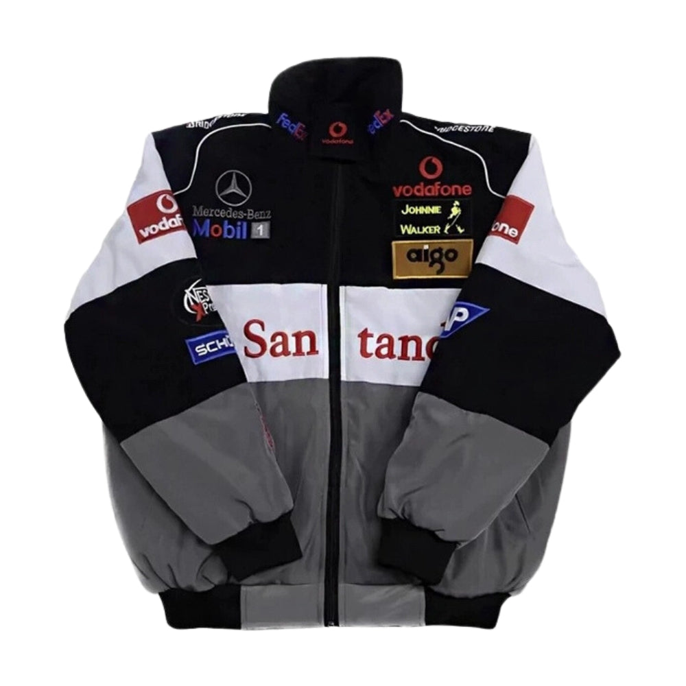 Front view of a vintage Mercedes-Benz F1 racing jacket featuring classic Mercedes branding and sponsor logos. The jacket is crafted from premium, durable fabric with a smooth finish, offering both comfort and a timeless motorsport aesthetic that pays tribute to Mercedes’ F1 legacy.