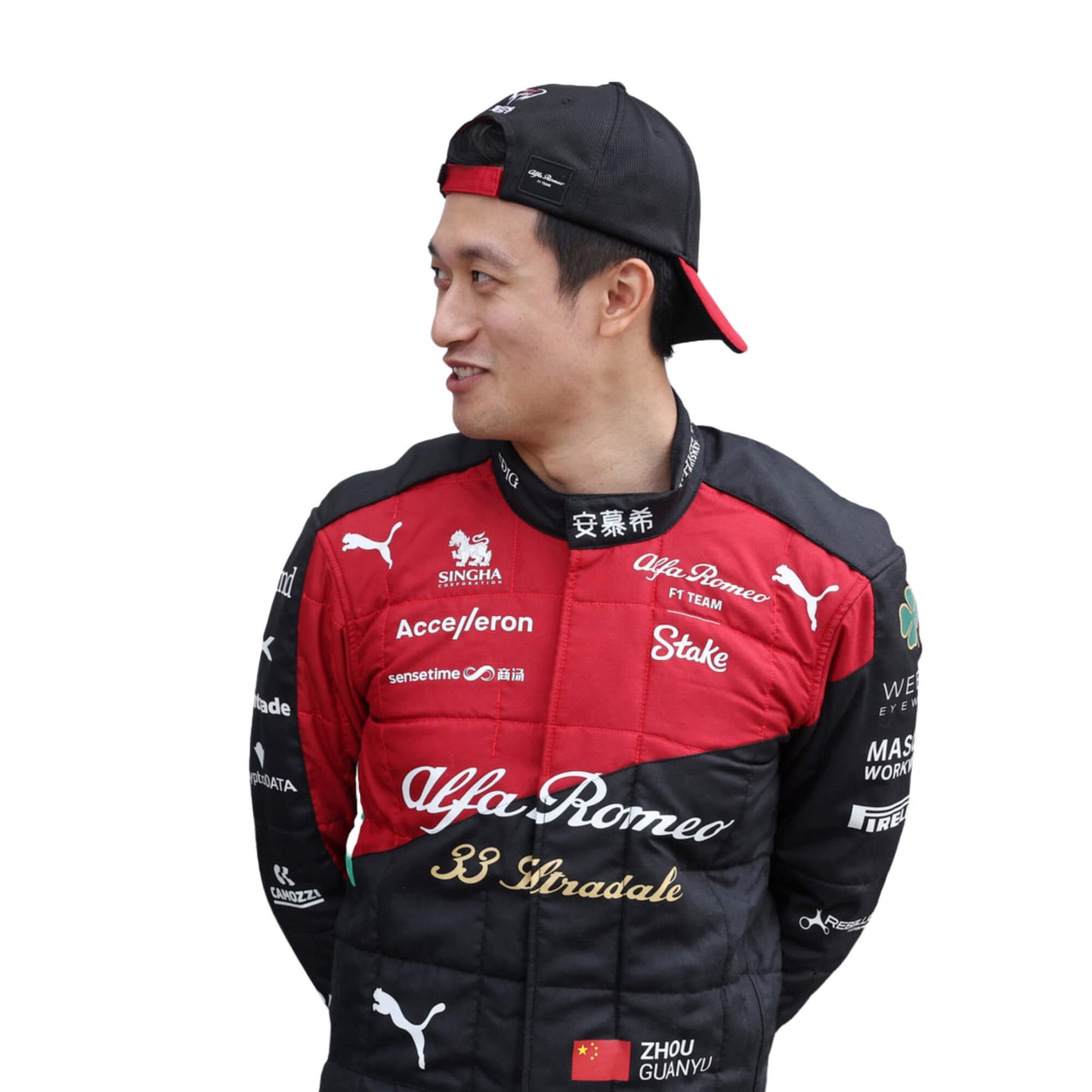 Close-up of Zhou’s 2023 Italian Grand Prix F1 racing suit fabric texture and stitched sponsor logos, detailing the high-quality materials and the integration of the black, red, and gold color palette.