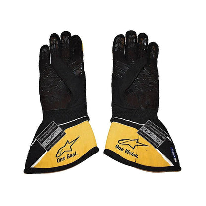 Pair of black and yellow Nico Hulkenberg 2018 F1 Racing gloves with visible branding on a white background