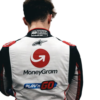 oliver wearing a racing suit with visible branding on the back