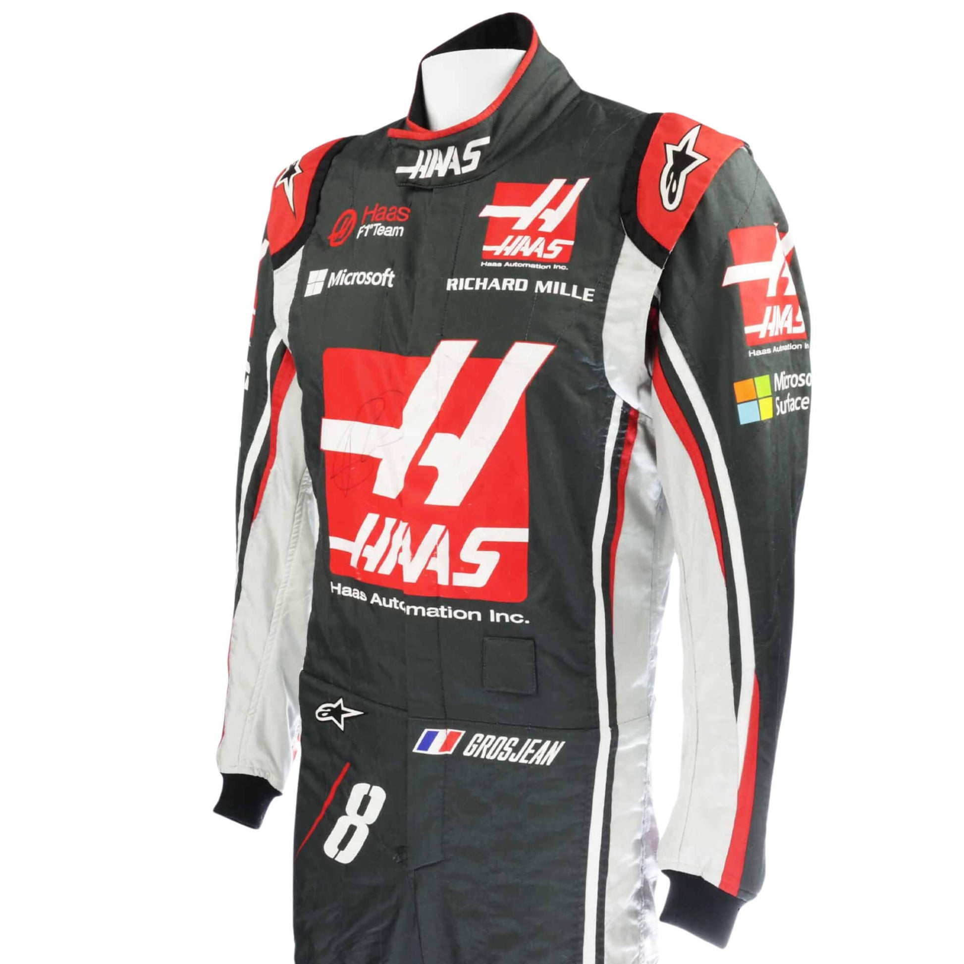 Close-up of the sleeve on Romain Grosjean’s 2017 F1 racing suit, featuring embroidered sponsor logos and high-performance construction.