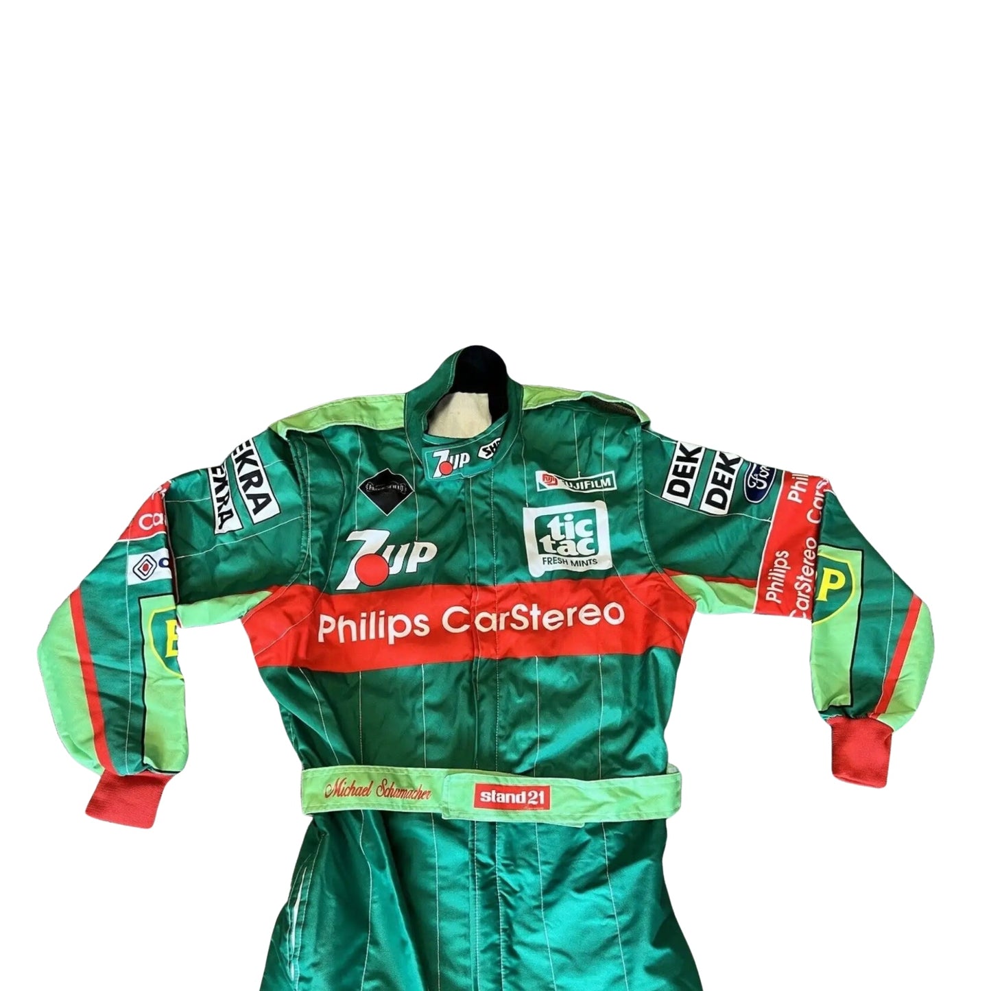 front close up view with arms of Schumacher’s 1991 race suit from the Belgian GP, highlighting embroidered sponsor logos and the lightweight two-layer fabric.